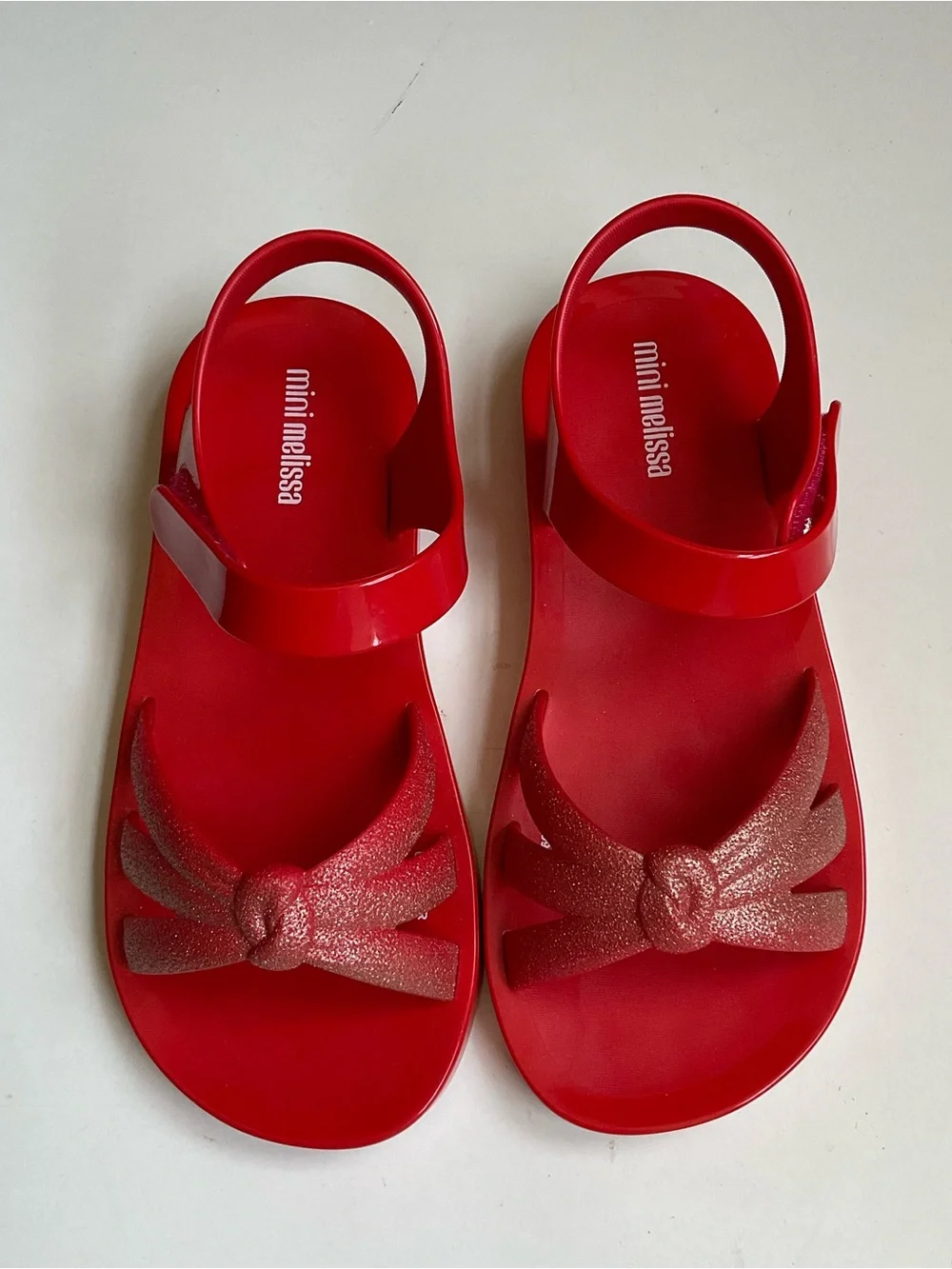 Mini Melissa Red Kids' Sandals with Glitter Bow Accent